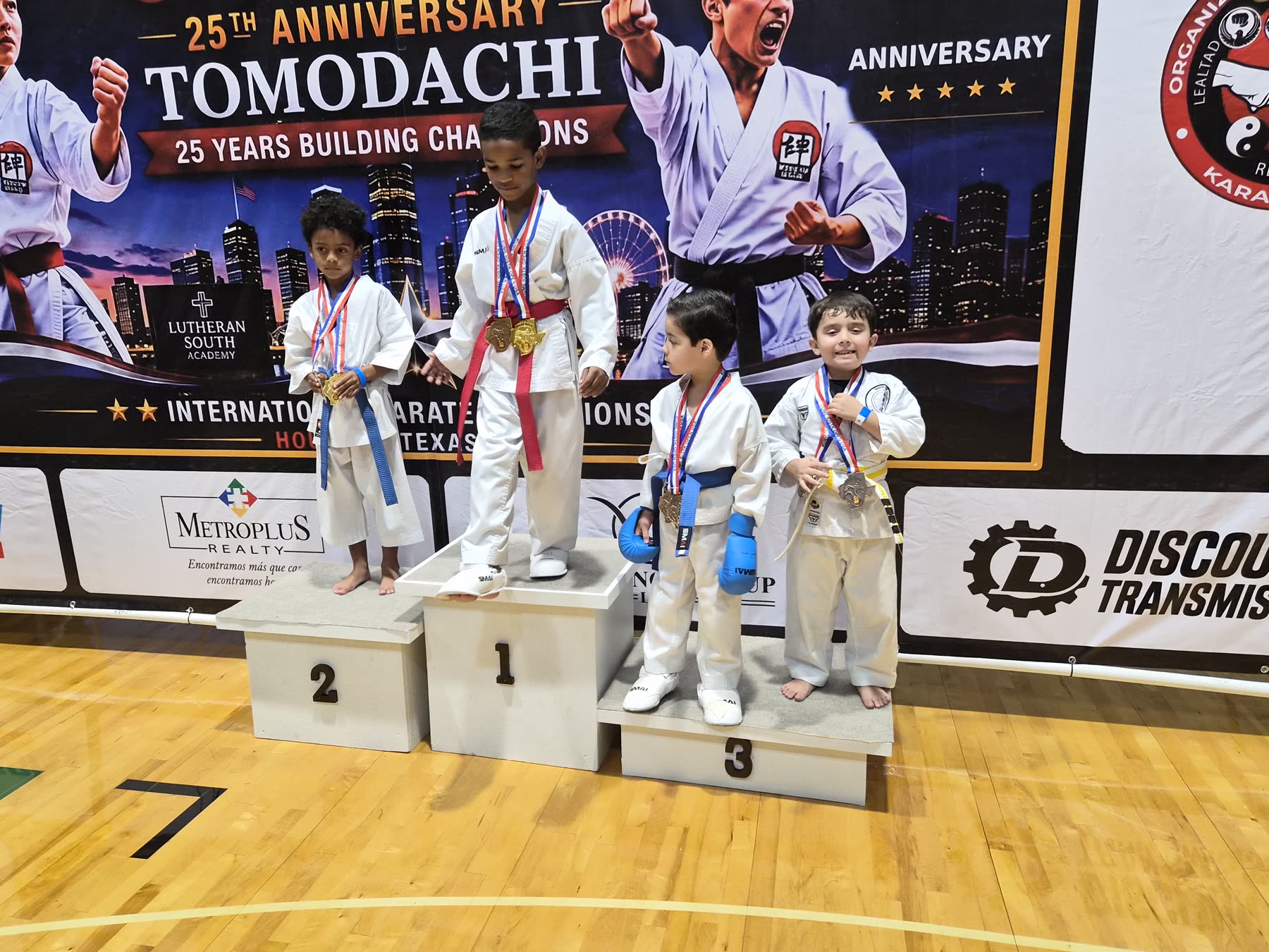 Young karate athletes on a tournament awards podium